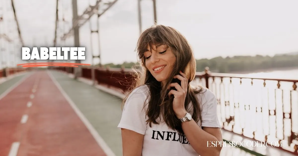 Woman wearing Babeltee organic cotton t-shirt in urban setting, promoting conscious streetwear.