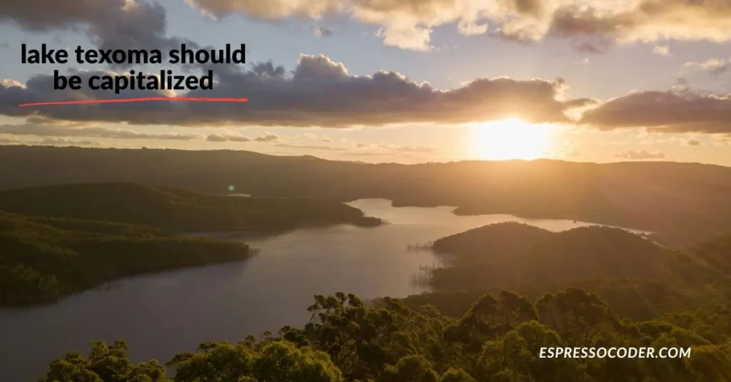 Denison Dam at Lake Texoma with sunset light and calm water.