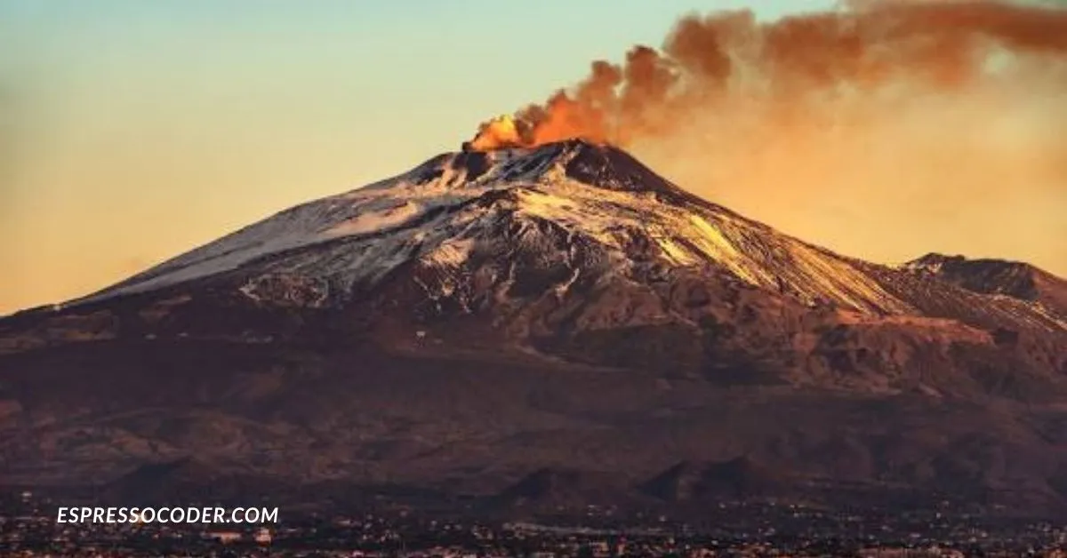Mongibello Etna volcanic eruption night aerial view with glowing lava streams in Sicily.